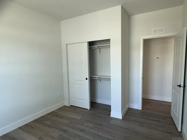 a view of a livingroom with wooden floor