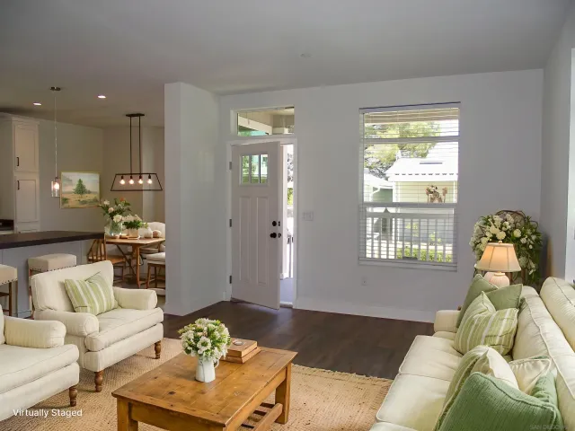 a living room with furniture and a window
