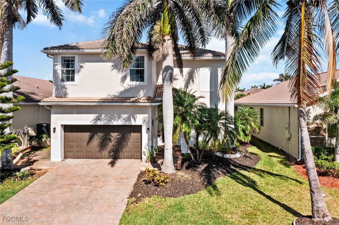 8657 Sumner Avenue Fort Myers, FL 33908 - Photo 2 of 29 a front view of a house with a yard