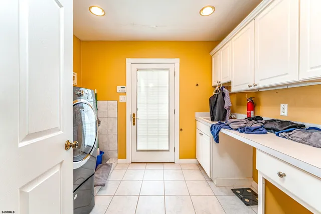 a view of a kitchen with a sink stove and refrigerator