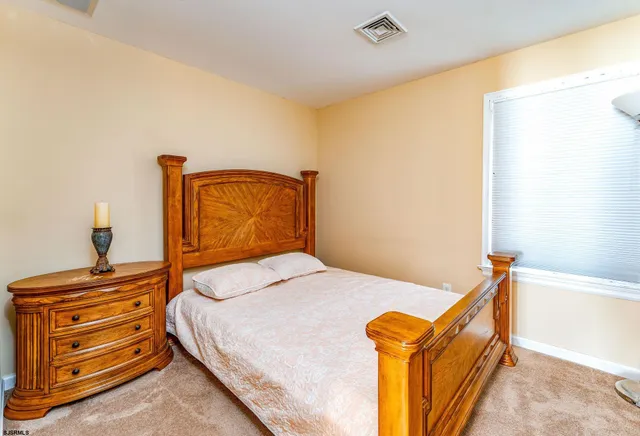 a bed room with a bed and a couch