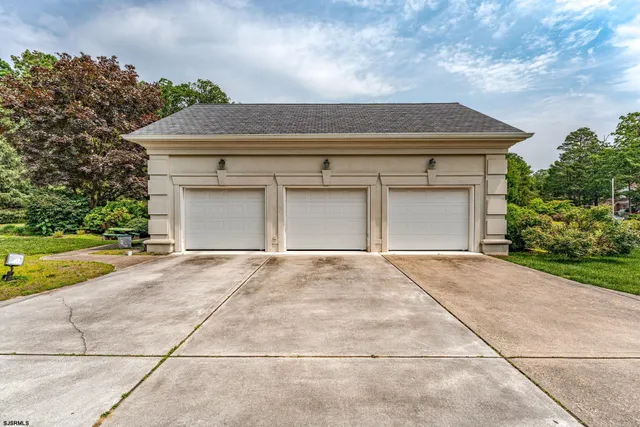 an aerial view of residential houses with outdoor space and street view