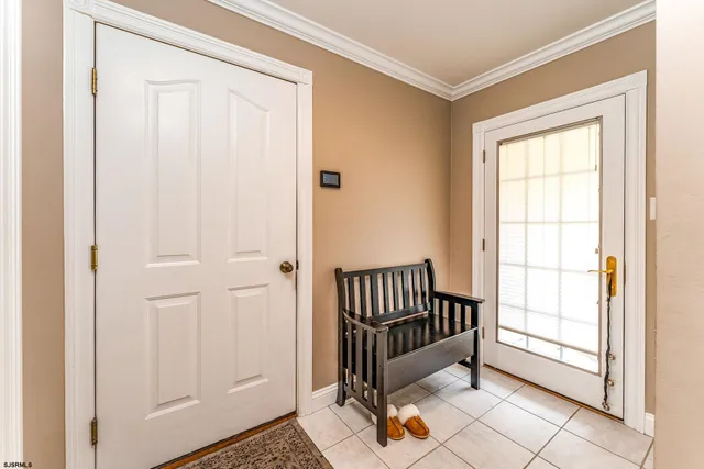 a view of a porch with a door and a window
