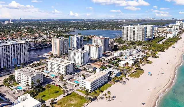 a kitchen with stainless steel appliances a refrigerator sink and microwave