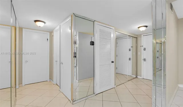 a bathroom with a granite countertop sink mirror vanity and toilet