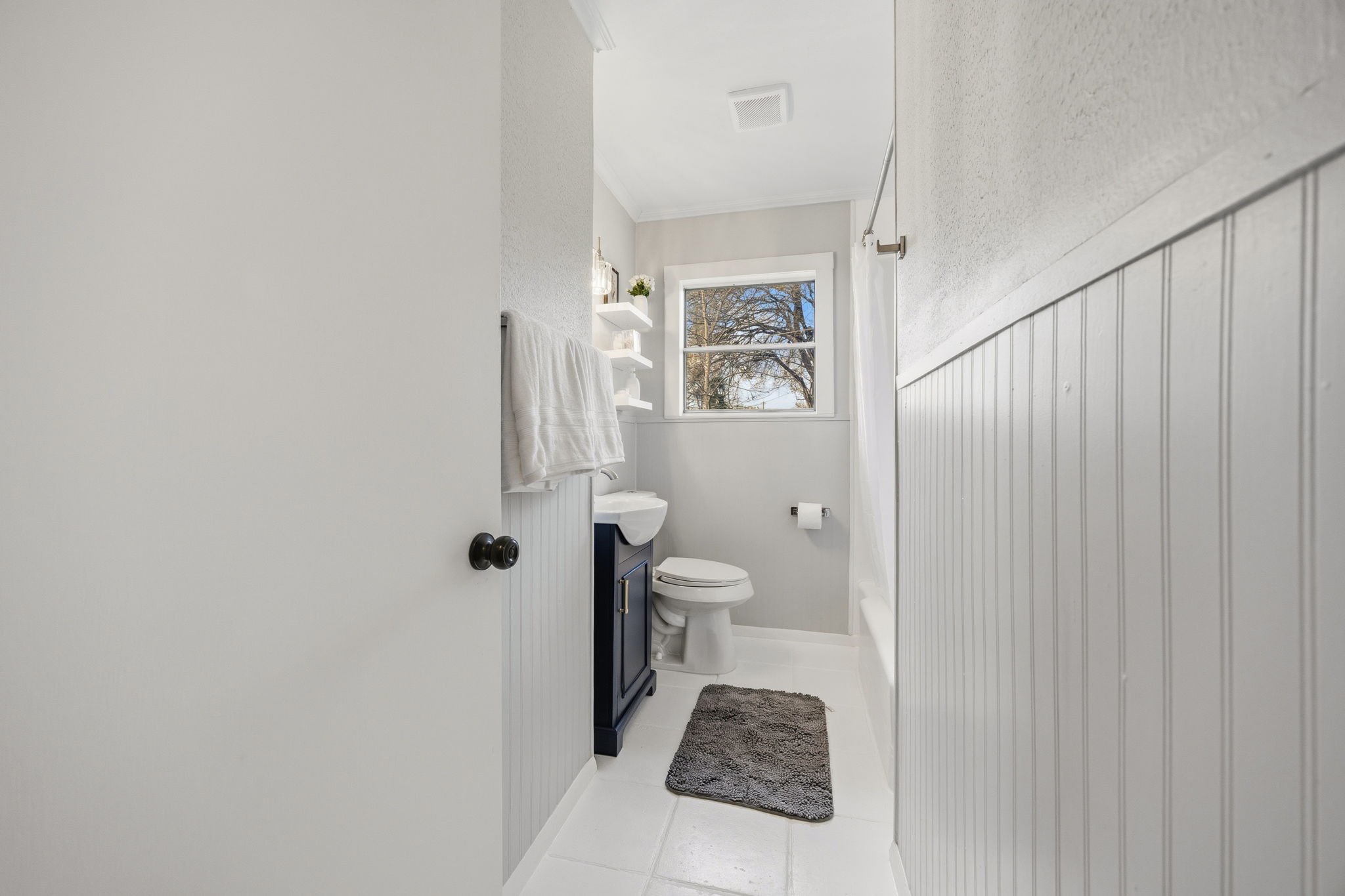 1402 Kent Street Taylor, TX 76574 - Photo 16 of 25 a bathroom with a toilet and a shower