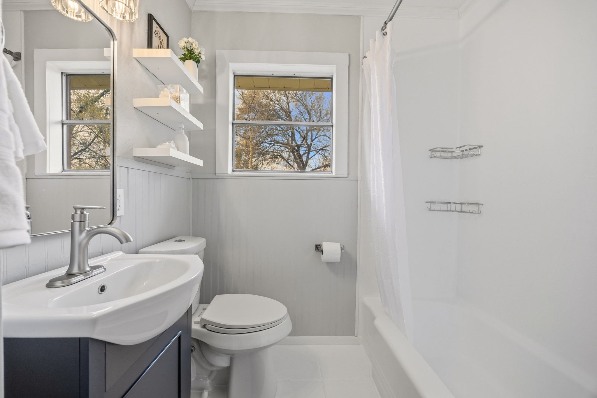 1402 Kent Street Taylor, TX 76574 - Photo 17 of 25 a bathroom with a sink toilet and a mirror