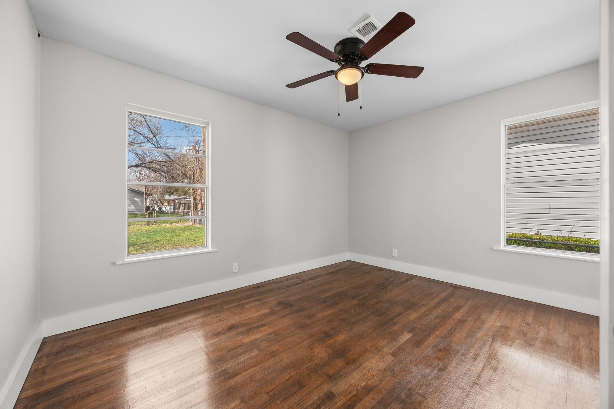 1402 Kent Street Taylor, TX 76574 - Photo 18 of 25 wooden floor in an empty room with a window