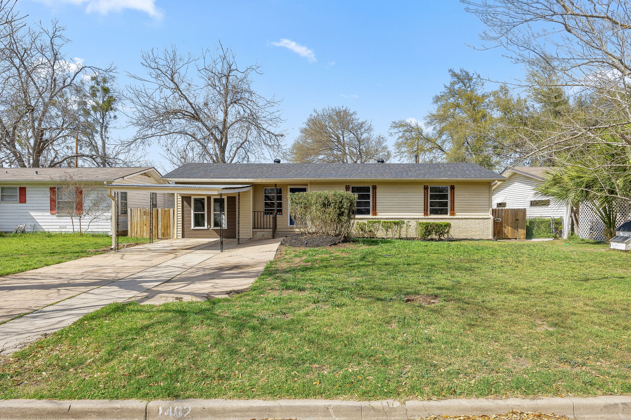 1402 Kent Street Taylor, TX 76574 - Photo 2 of 25 a front view of a house with a yard