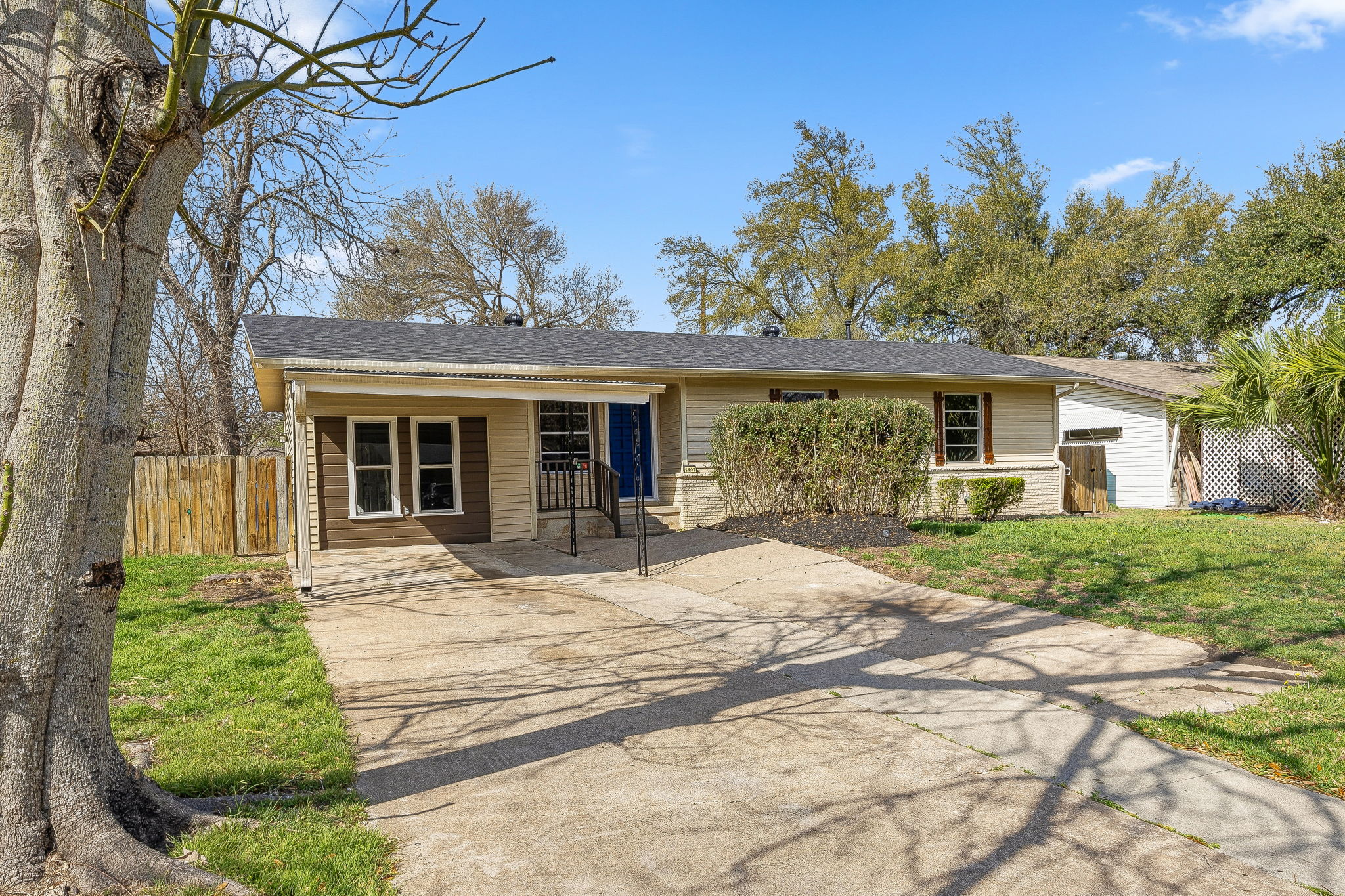 1402 Kent Street Taylor, TX 76574 - Photo 3 of 25 a front view of a house with a yard
