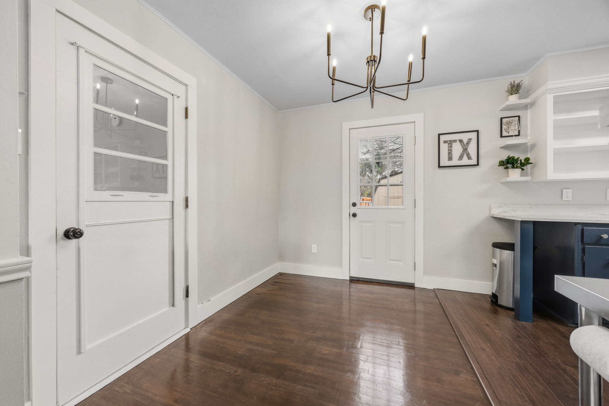 1402 Kent Street Taylor, TX 76574 - Photo 10 of 25 a view of a hallway with entryway windows chandelier and front door