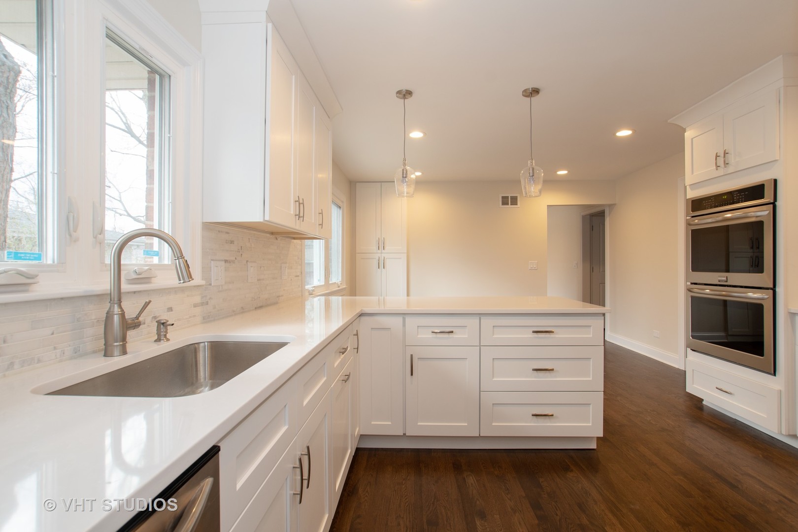 2010 Clover Road Northbrook, IL 60062 - Photo 14 of 30 a kitchen with a sink dishwasher a stove and a refrigerator with wooden floor
