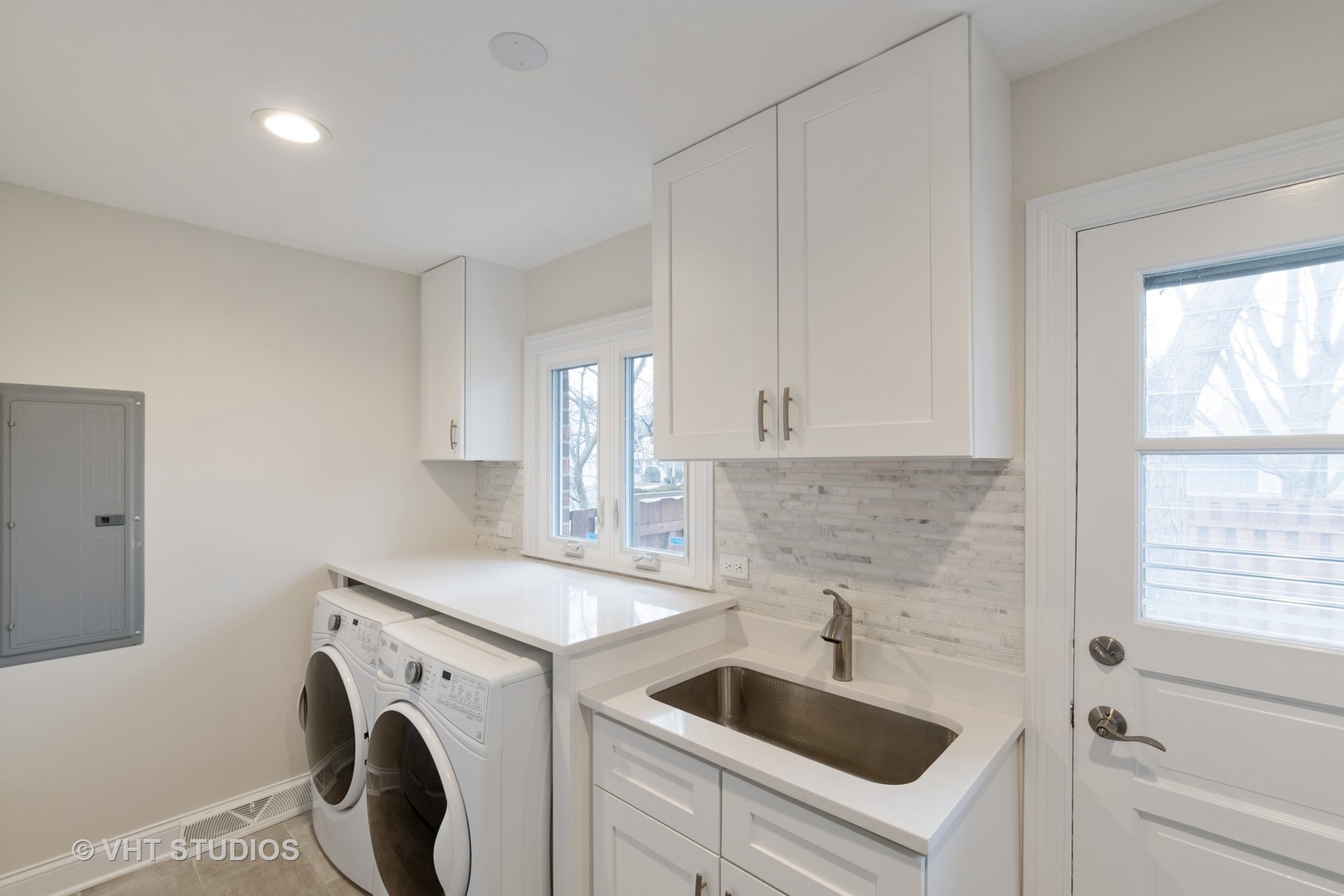 2010 Clover Road Northbrook, IL 60062 - Photo 18 of 30 a kitchen with a sink cabinets and a washer dryer