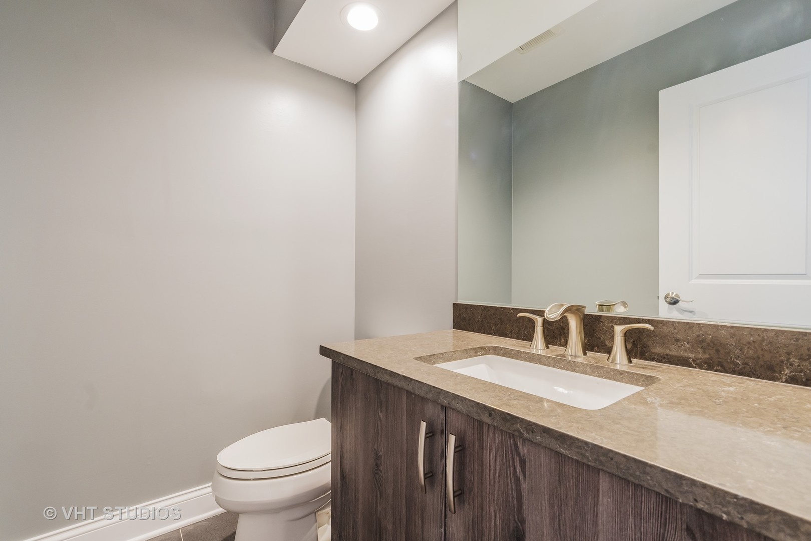 2010 Clover Road Northbrook, IL 60062 - Photo 20 of 30 a bathroom with a granite countertop sink a toilet and a mirror