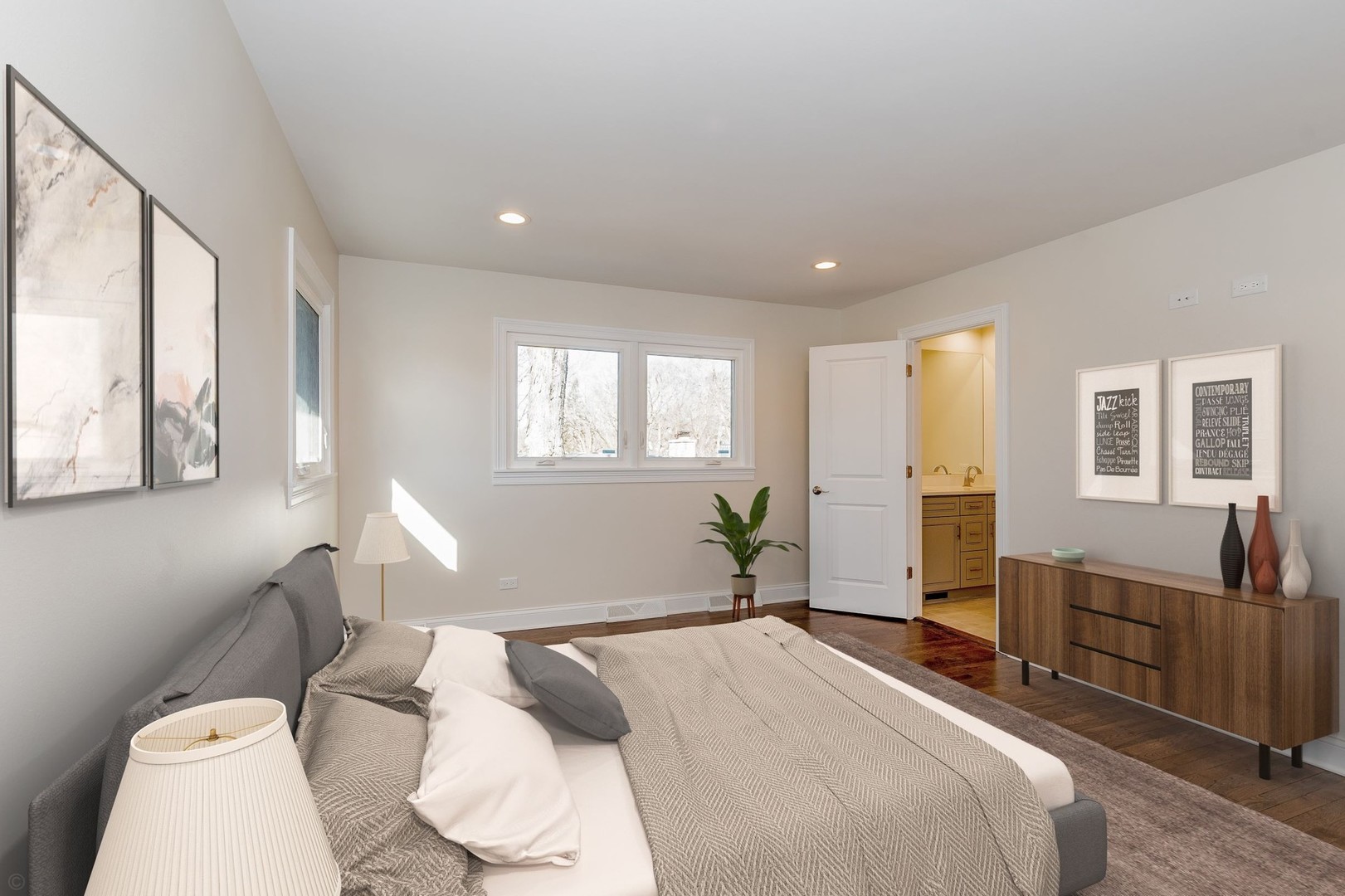 2010 Clover Road Northbrook, IL 60062 - Photo 21 of 30 a spacious bedroom with a bed and wooden floor