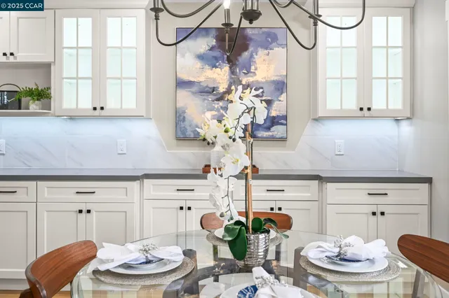 a kitchen with a table and chairs