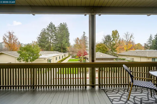 a view of a balcony with wooden floor