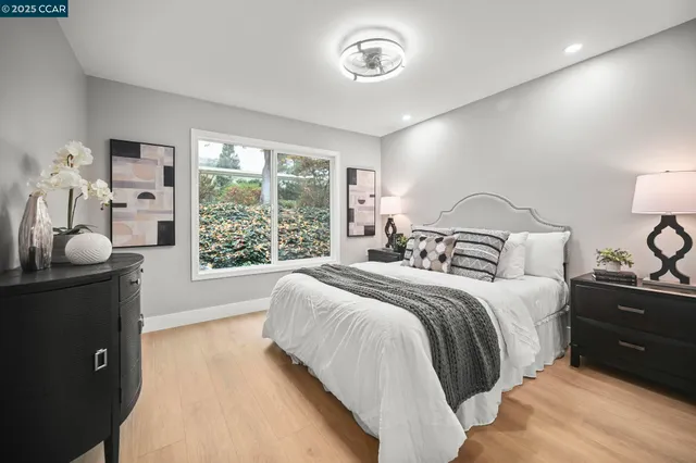 a bedroom with a bed and a lamp