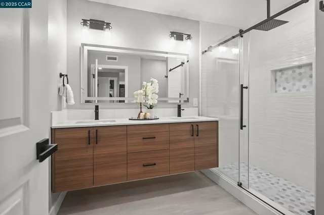 a bathroom with a sink and a mirror