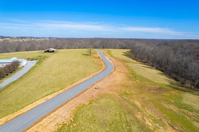 a view of a swimming pool and an outdoor seating