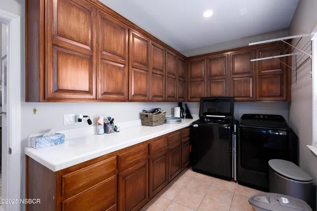 a kitchen with a sink cabinets and appliances