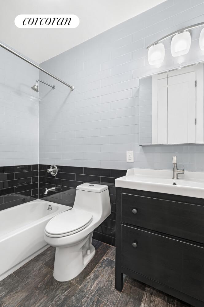 825 West 179th Street, Unit 2E Manhattan, NY 10033 - Photo 5 of 9 a bathroom with a sink a toilet and bathtub