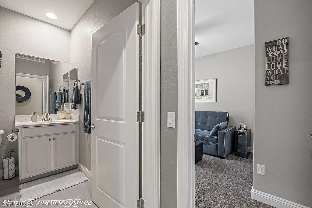 1304 Cottage Ridge Mesquite, NV 89034 - Photo 23 of 52 A well-appointed bathroom offers convenient access to an adjoining flex space, perfect for quiet contemplation.