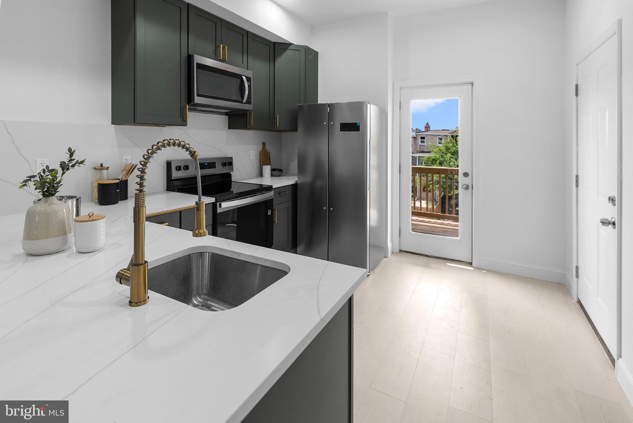 2106 McCulloh Street Baltimore, MD 21217 - Photo 11 of 38 a kitchen with a refrigerator sink and microwave