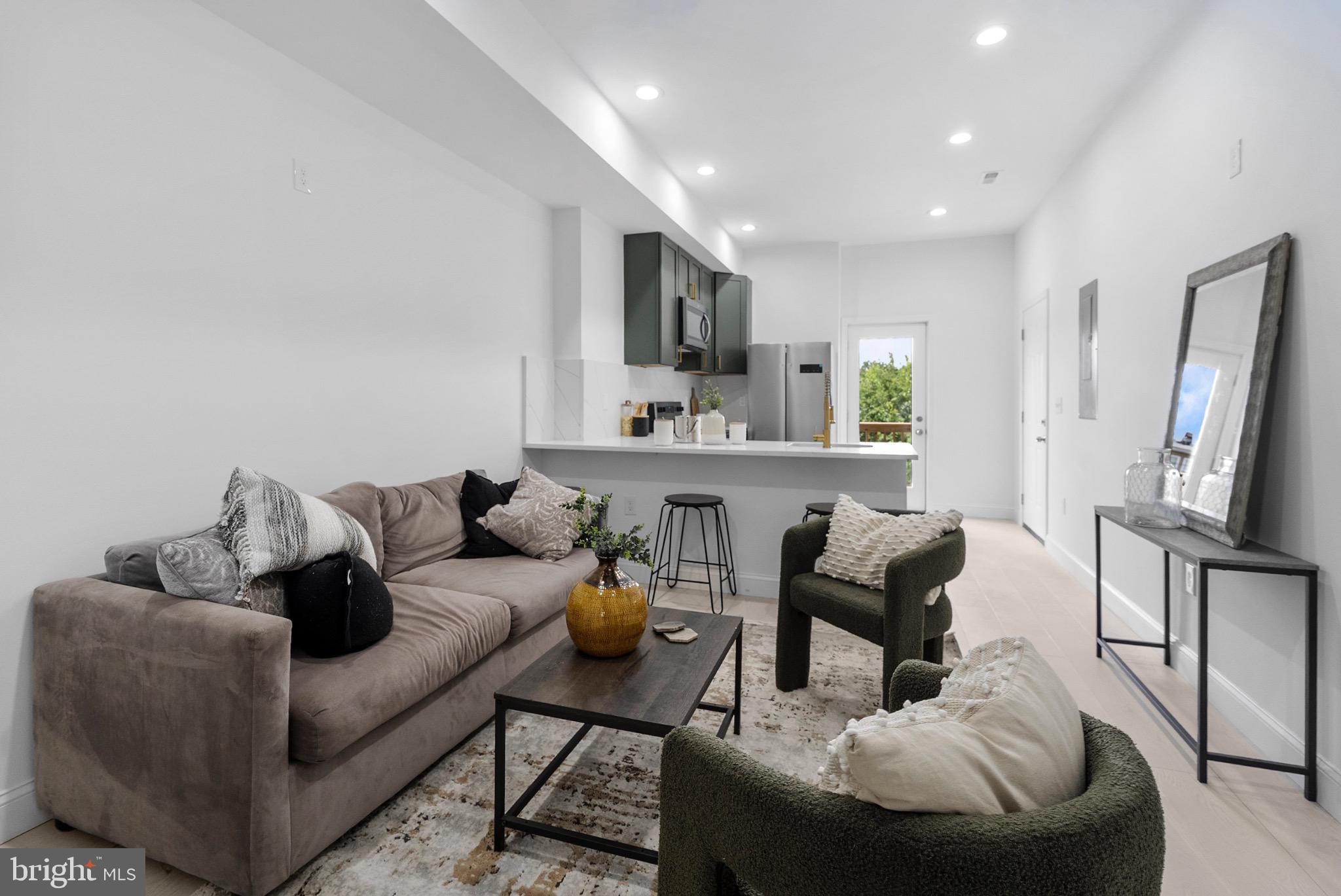 2106 McCulloh Street Baltimore, MD 21217 - Photo 14 of 38 a living room with furniture and a flat screen tv