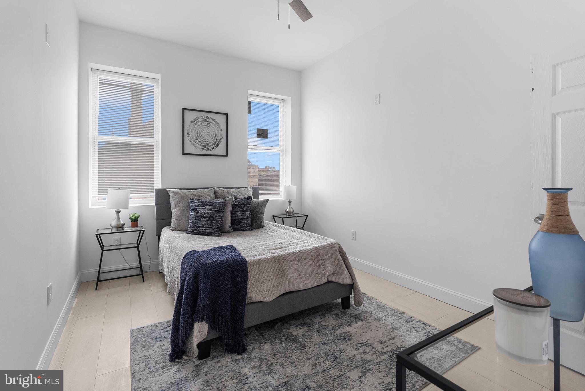 2106 McCulloh Street Baltimore, MD 21217 - Photo 27 of 38 a bed room with a bed and a chair