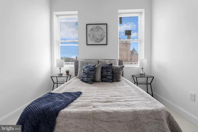 a bedroom with a large bed and a table