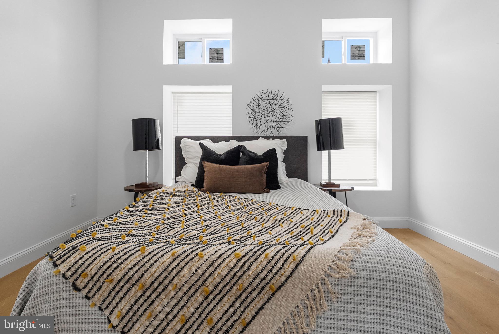 2106 McCulloh Street Baltimore, MD 21217 - Photo 7 of 38 a bedroom with a bed and a night stand