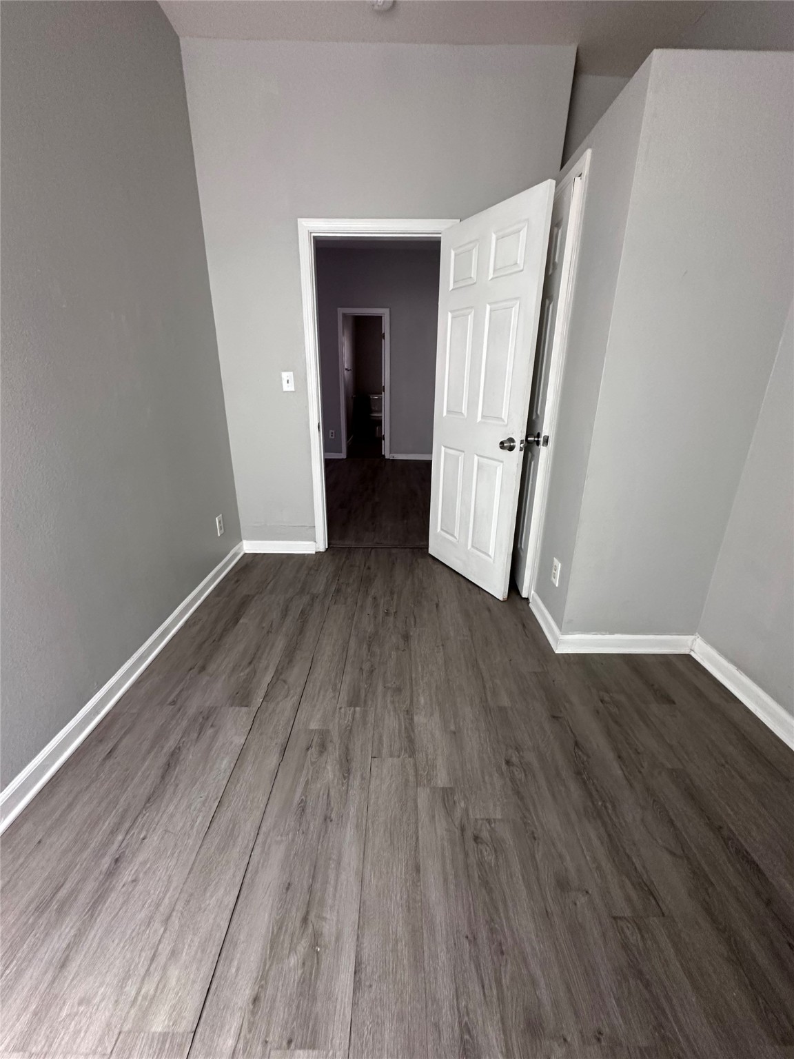 910 37th Street, Unit 3 Galveston, TX 77550 - Photo 17 of 18 a view of a room with wooden floor and staircase