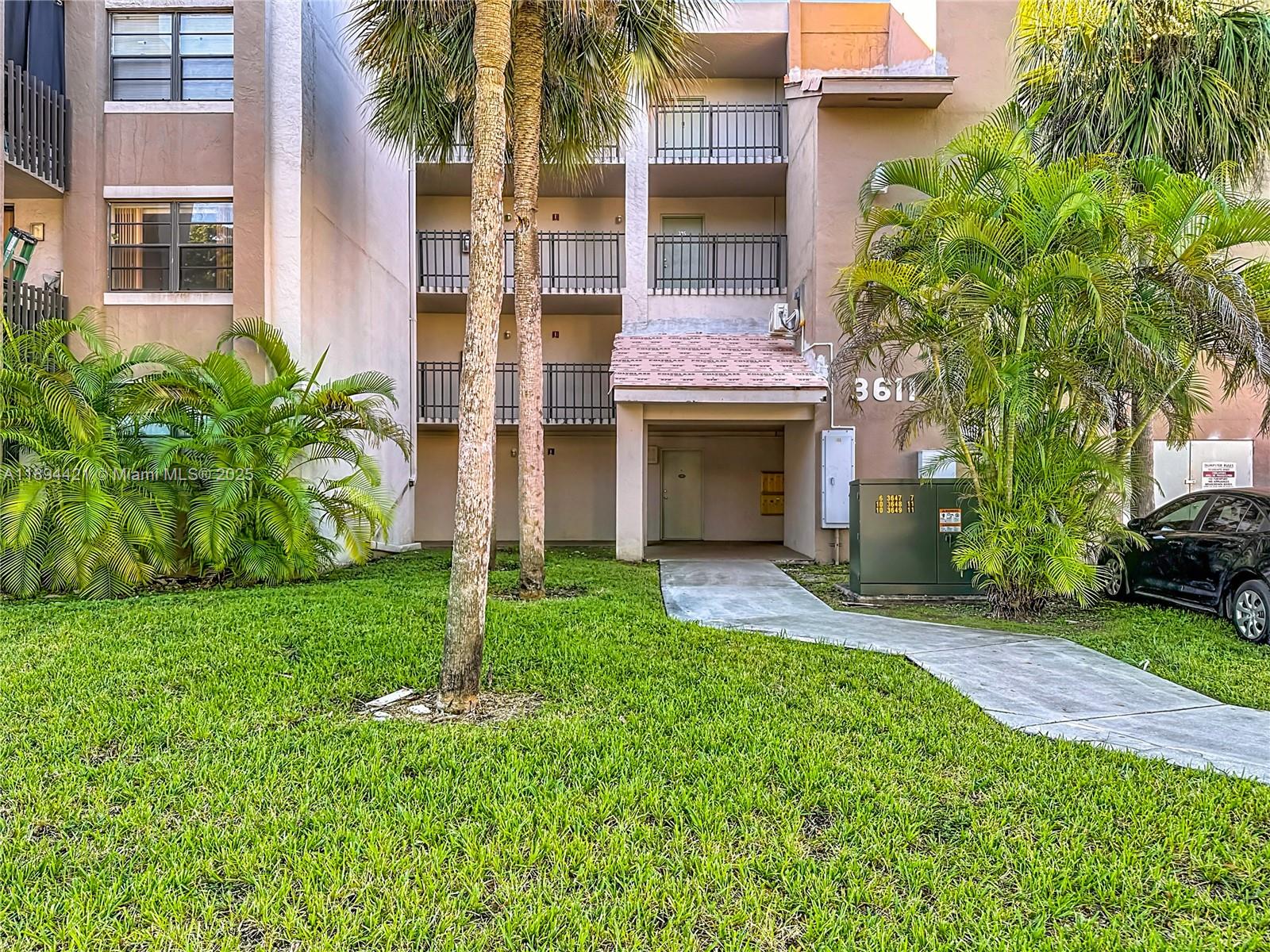 3611 Southwest 117th Avenue, Unit 10207 Miami, FL 33175 - Photo 22 of 35 a view of a house with a yard and plants
