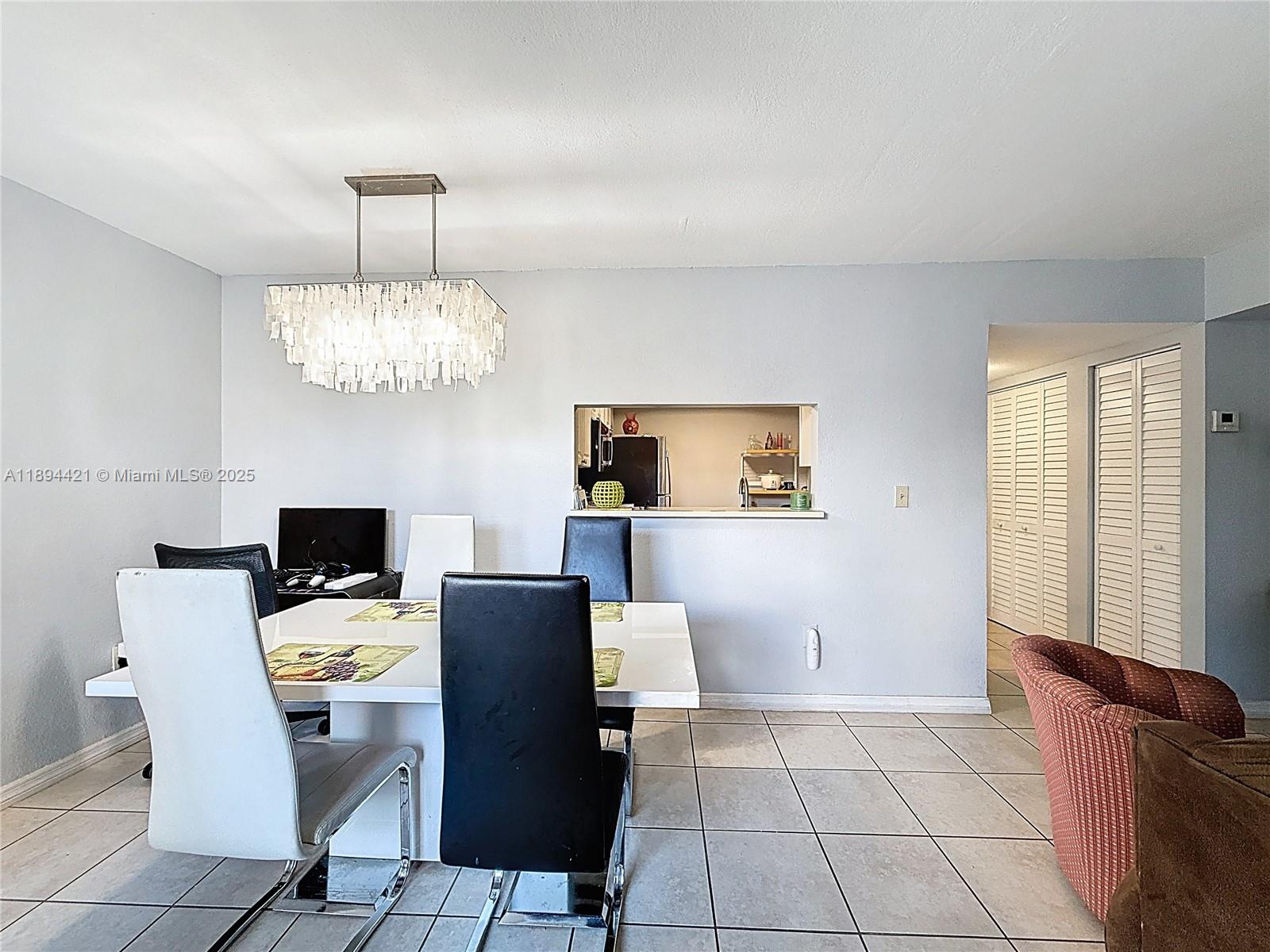 3611 Southwest 117th Avenue, Unit 10207 Miami, FL 33175 - Photo 7 of 35 a view of a dining room with furniture