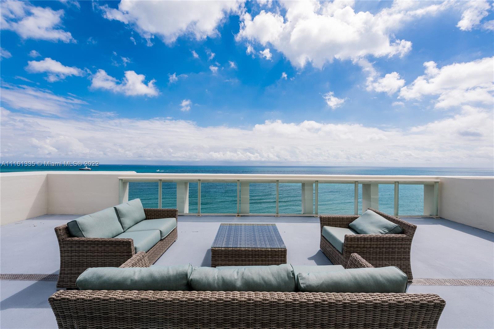 a outdoor living space with furniture and city view