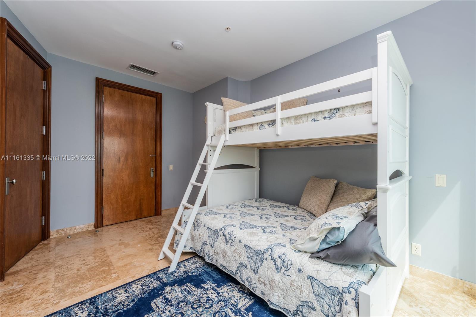 9499 Collins Avenue, Unit PH2 Surfside, FL 33154 - Photo 12 of 38 a bedroom with a bed and a window