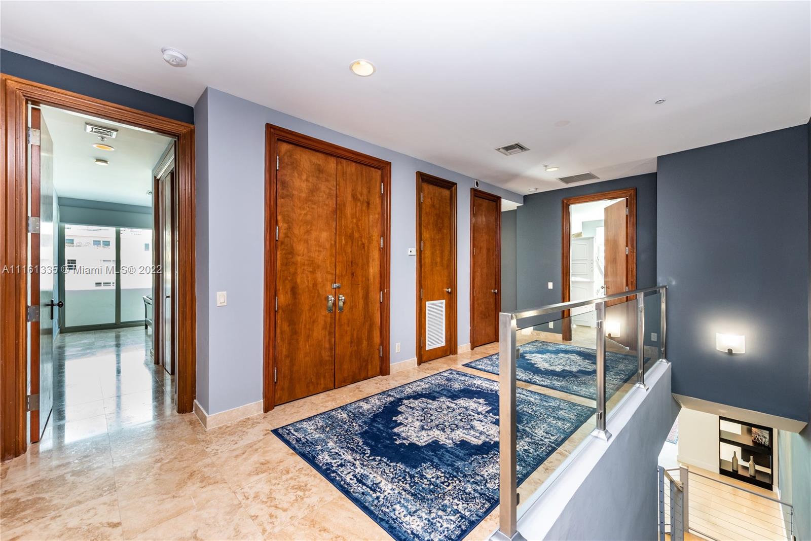9499 Collins Avenue, Unit PH2 Surfside, FL 33154 - Photo 15 of 38 a view of a hallway view with living room and dining room