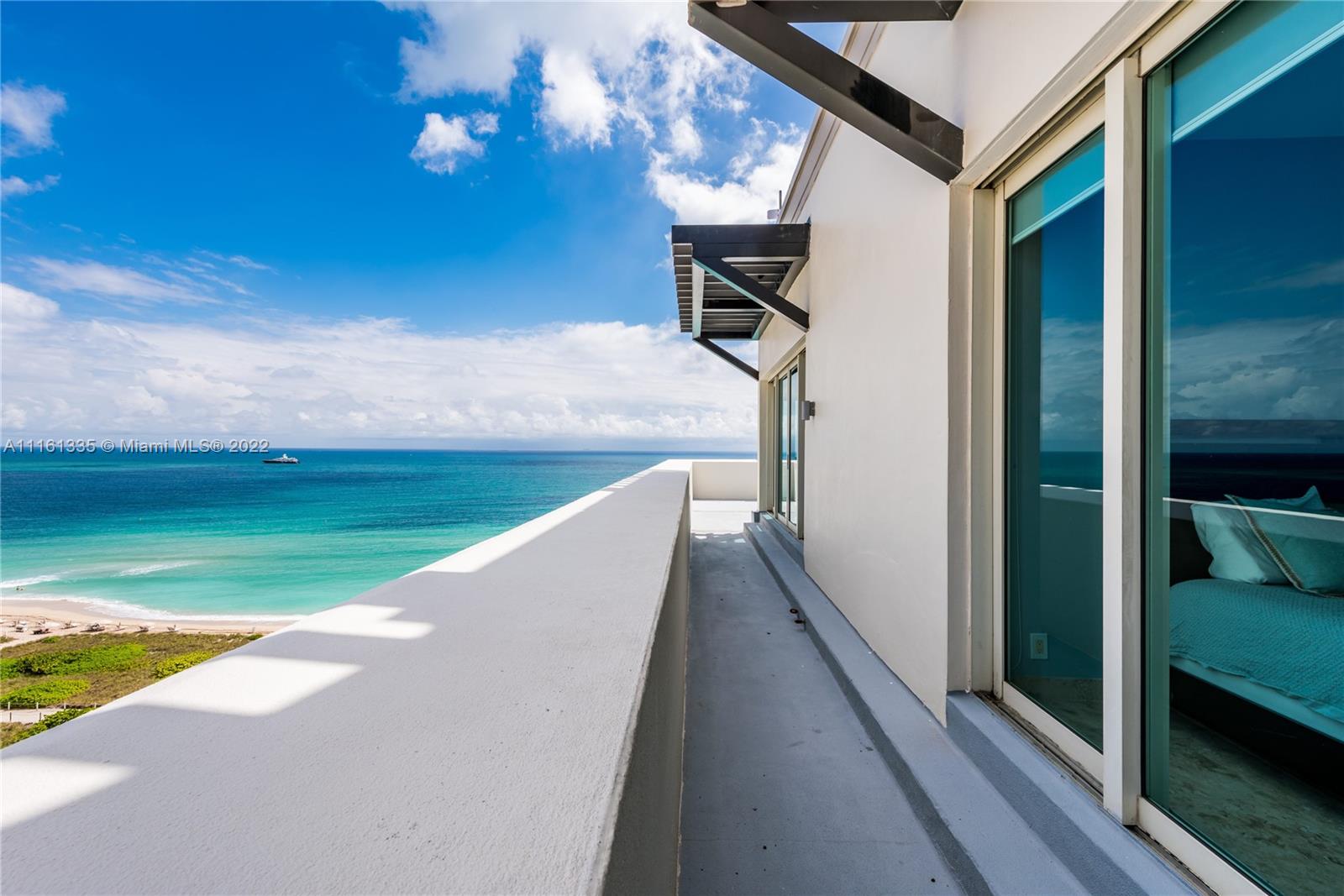 9499 Collins Avenue, Unit PH2 Surfside, FL 33154 - Photo 18 of 38 a view of a swimming pool and a yard