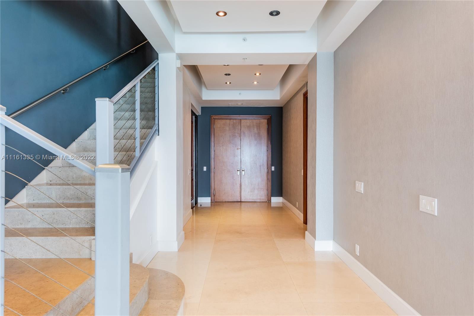 9499 Collins Avenue, Unit PH2 Surfside, FL 33154 - Photo 19 of 38 a view of hallway with stairs