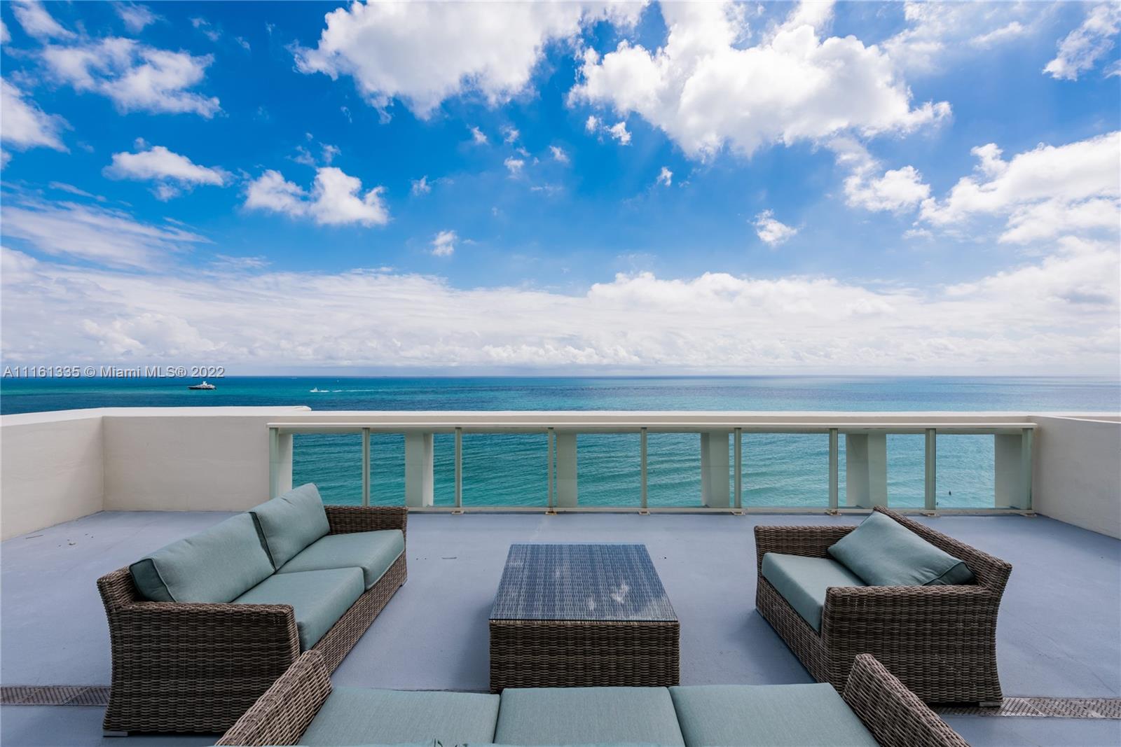 9499 Collins Avenue, Unit PH2 Surfside, FL 33154 - Photo 24 of 38 a view of a couches in the roof deck