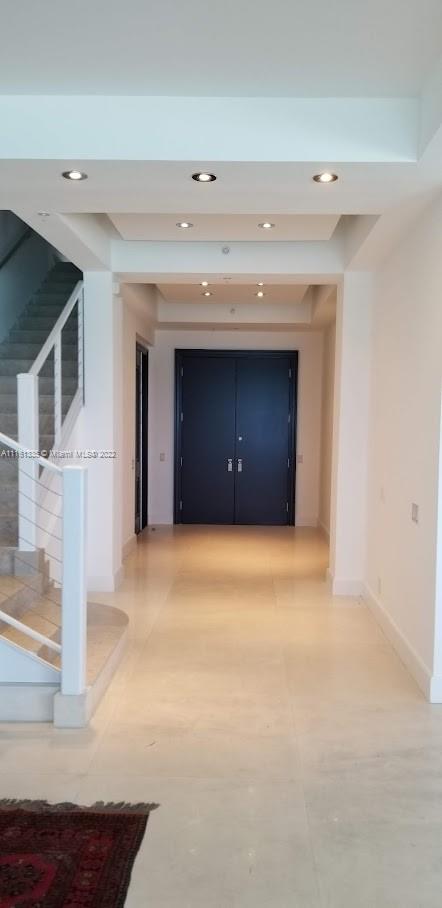 9499 Collins Avenue, Unit PH2 Surfside, FL 33154 - Photo 27 of 38 a view of an empty room with a fireplace