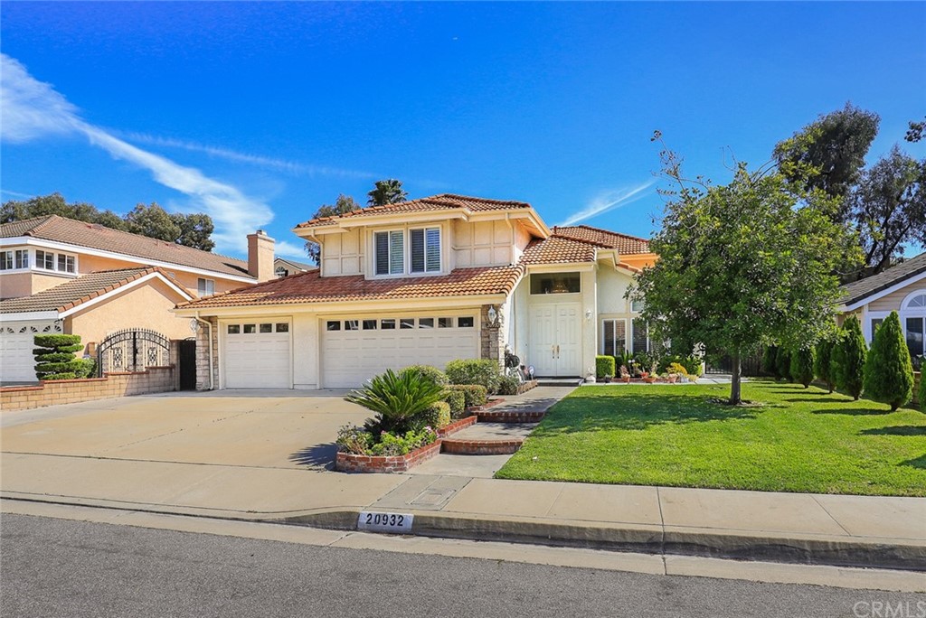 20932 Northview Drive Walnut, CA 91789 - Photo 1 of 1 a front view of a house with a garden and plants