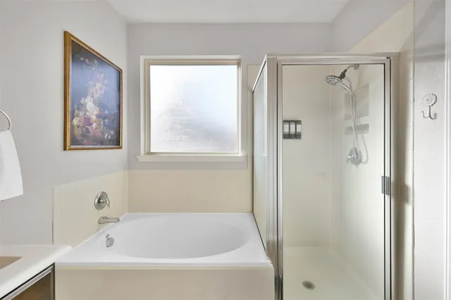 a bedroom with two beds and a chandelier