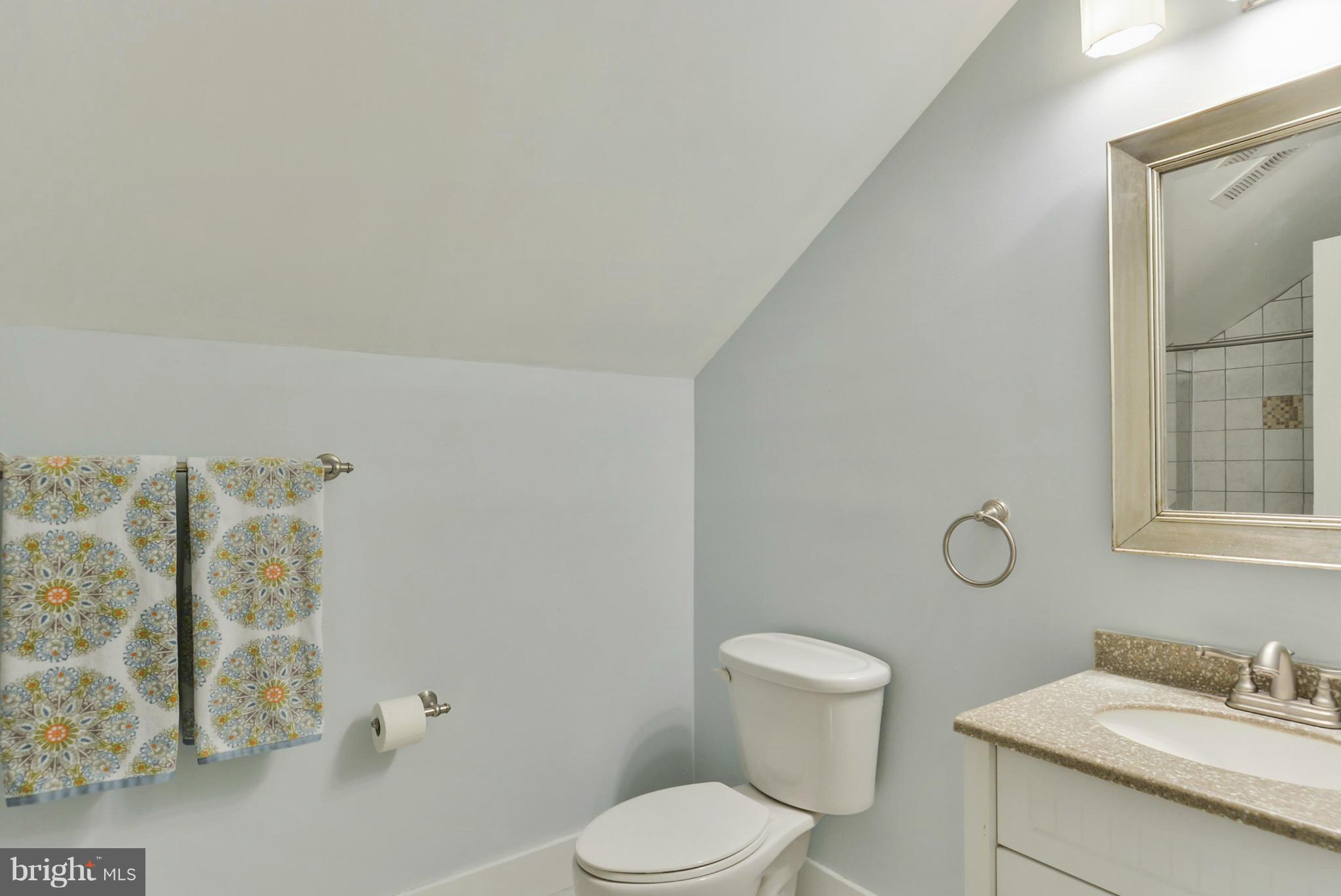 8822 1st Avenue Silver Spring, MD 20910 - Photo 21 of 30 a bathroom with a toilet sink and mirror