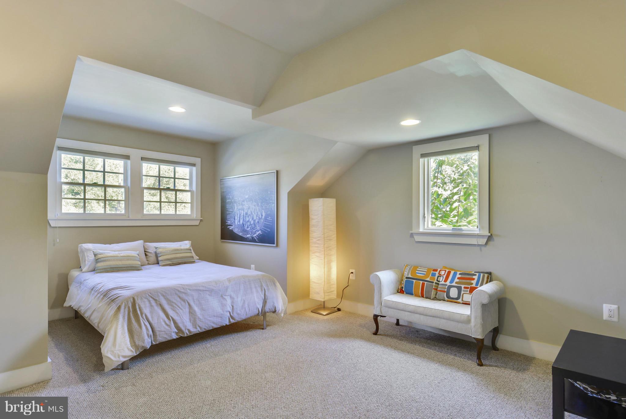 8822 1st Avenue Silver Spring, MD 20910 - Photo 23 of 30 a bedroom with a bed and a couch