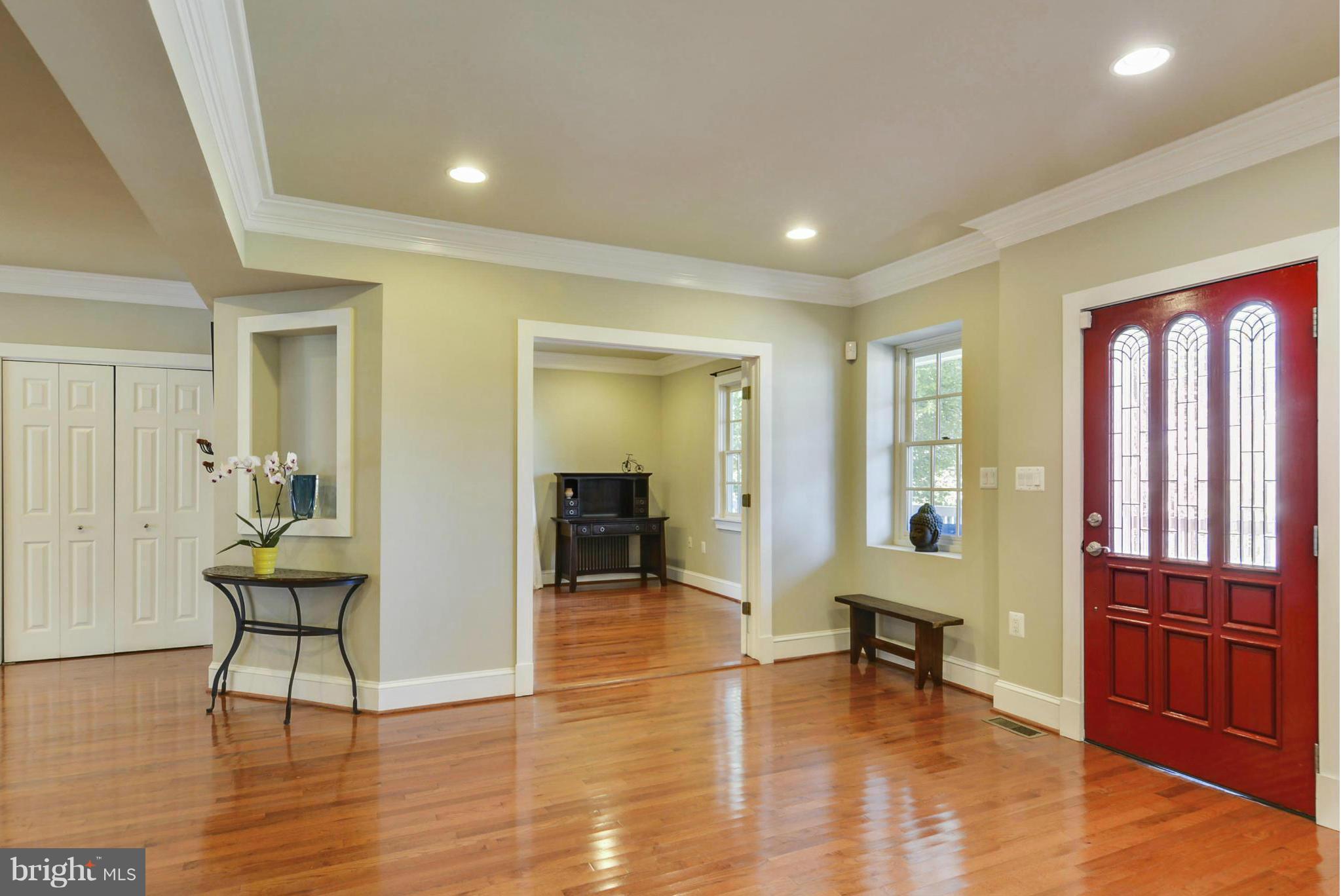 8822 1st Avenue Silver Spring, MD 20910 - Photo 5 of 30 a view of an entryway with wooden floor and furniture