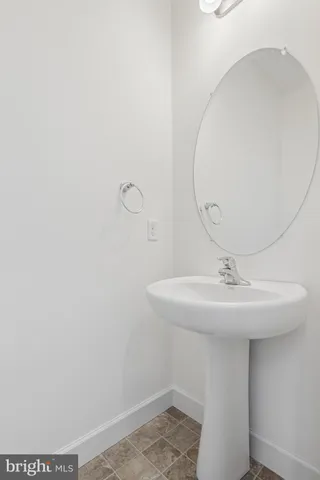 a bathroom with a sink and mirror