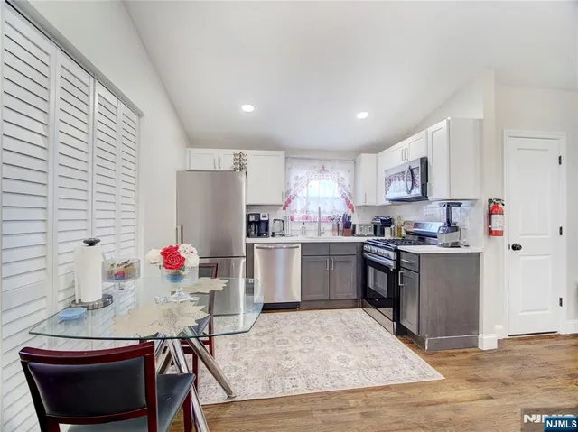 a kitchen with a sink cabinets and window