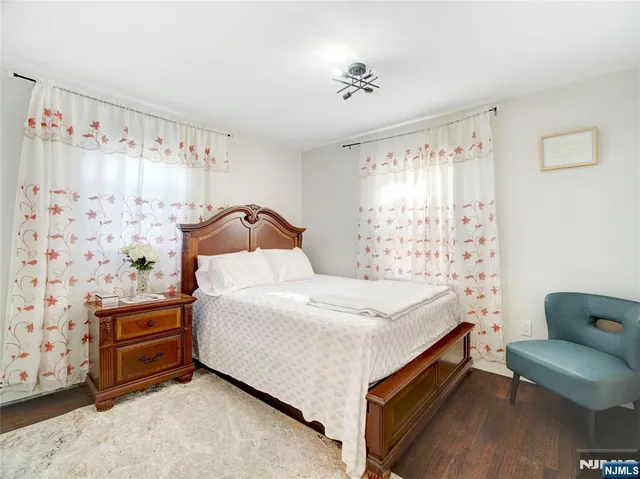 a bedroom with a bed and a chair